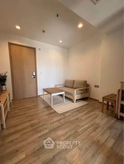 Cozy minimalist living room with wooden flooring and modern furniture