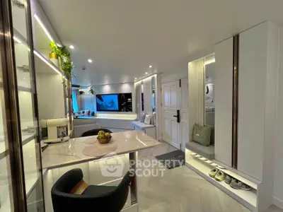 Modern open-plan living room with sleek kitchen and stylish decor