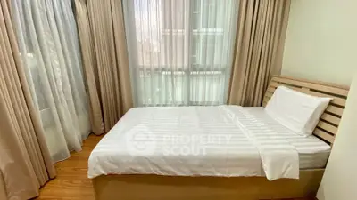 Cozy bedroom with natural light and modern decor