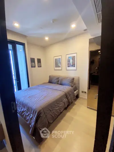 Cozy modern bedroom with stylish decor and natural light