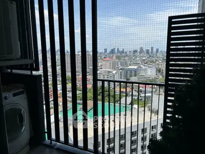 Stunning city view from high-rise balcony with washing machine