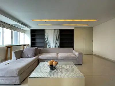 Spacious modern living room with sleek design and large windows