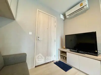 Cozy living room with modern air conditioning and sleek TV setup