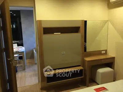 Cozy bedroom with modern wooden furniture and vanity mirror