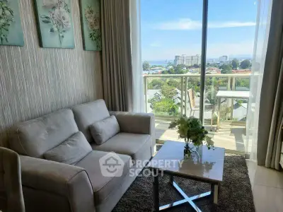 Modern living room with cozy sofa and stunning balcony view in urban apartment.
