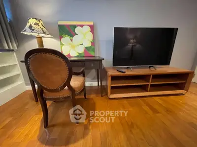 Cozy living room with elegant furniture and modern TV setup