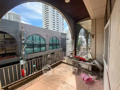 Spacious balcony with urban view in high-rise building