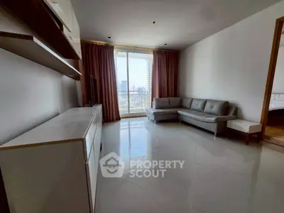 Spacious living room with modern sofa and city view balcony