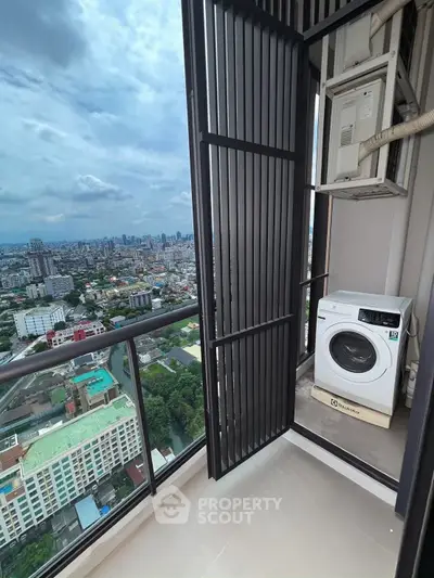 High-rise balcony with washing machine and stunning city view