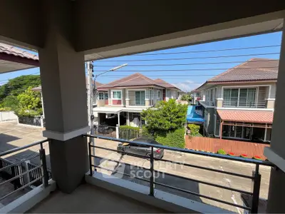 Charming suburban view from a spacious balcony in a modern residential area.