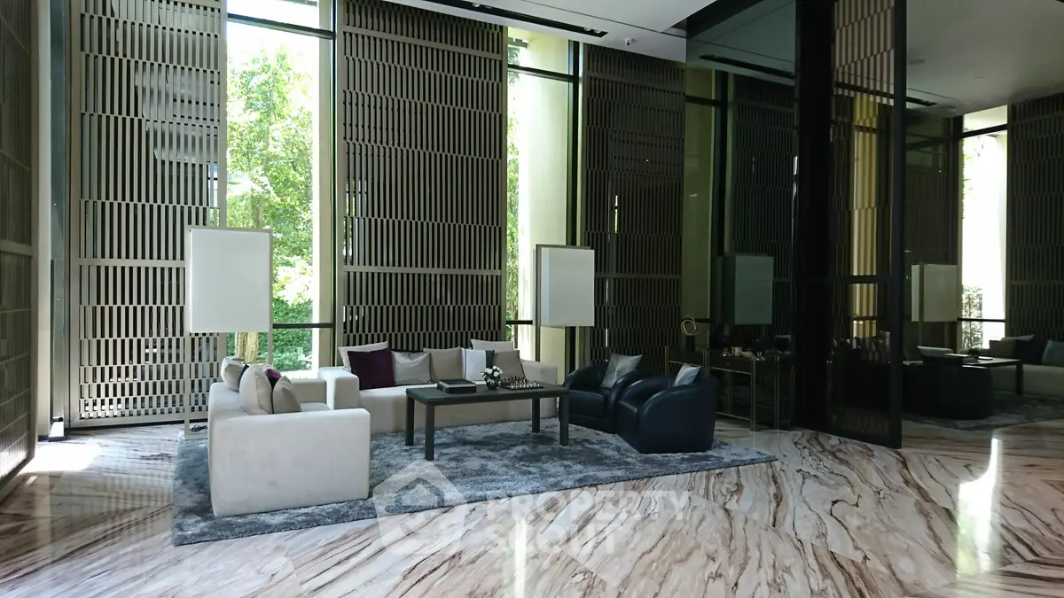 Luxurious modern living room with large windows and elegant furniture