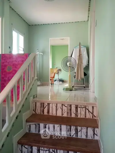Charming interior with unique staircase design and cozy living space, perfect for a stylish home.