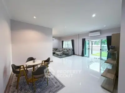 Spacious modern living room with open layout and elegant dining area