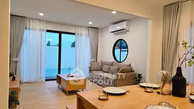 Modern living room with stylish decor and large window view
