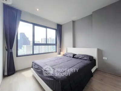 Modern bedroom with city view and sleek design