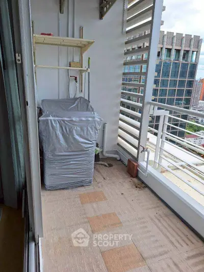 Spacious balcony with city view, ideal for relaxation and outdoor activities.
