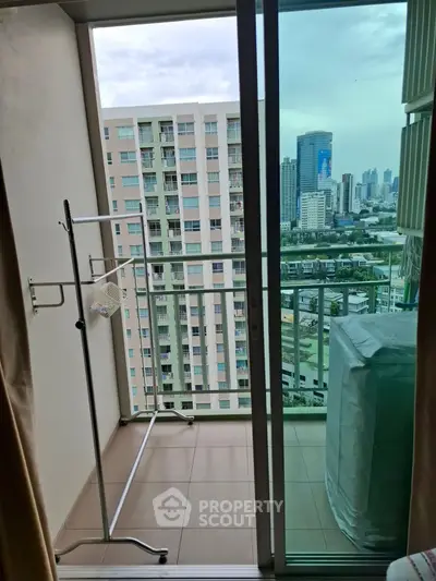 Charming balcony with city view, perfect for relaxation and enjoying the skyline.