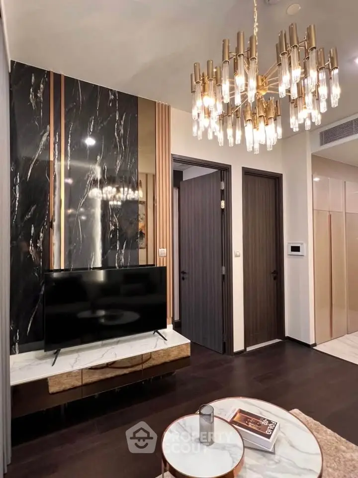 Luxurious living room with elegant chandelier and modern decor