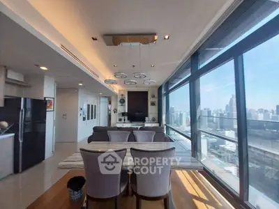 Luxurious modern living room with stunning city view and elegant dining area