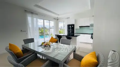 Modern open kitchen and dining area with pool view, featuring sleek design and bright ambiance.