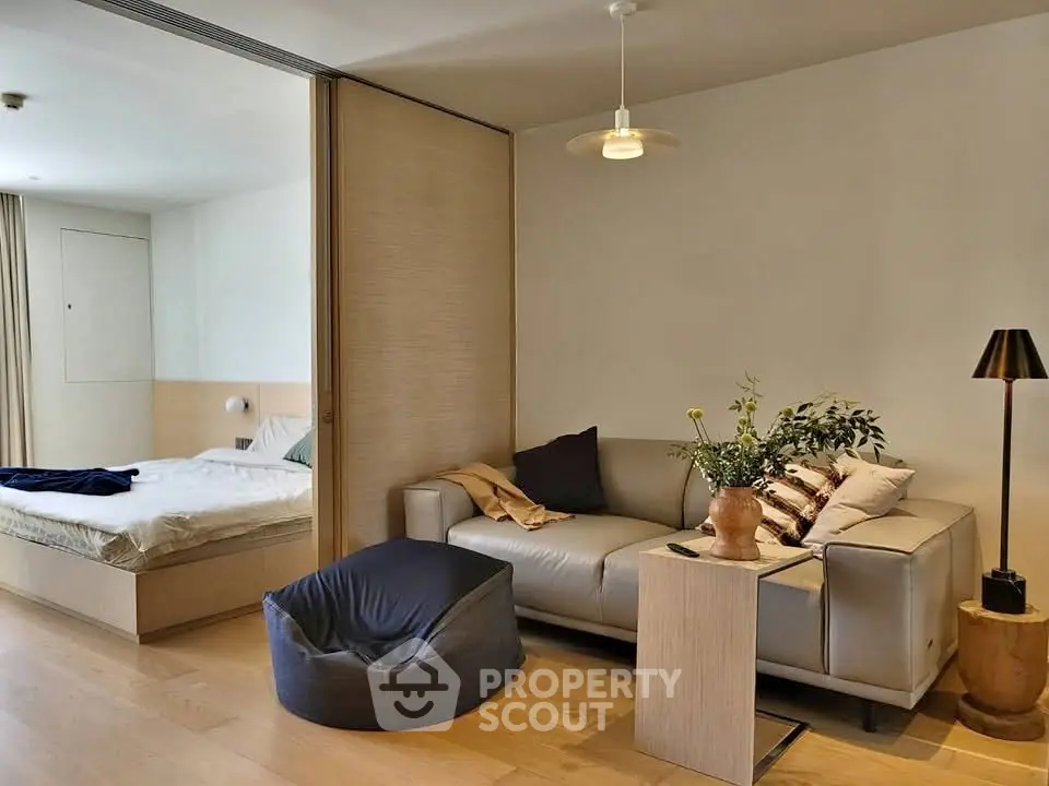 Modern studio apartment with cozy living area and stylish decor