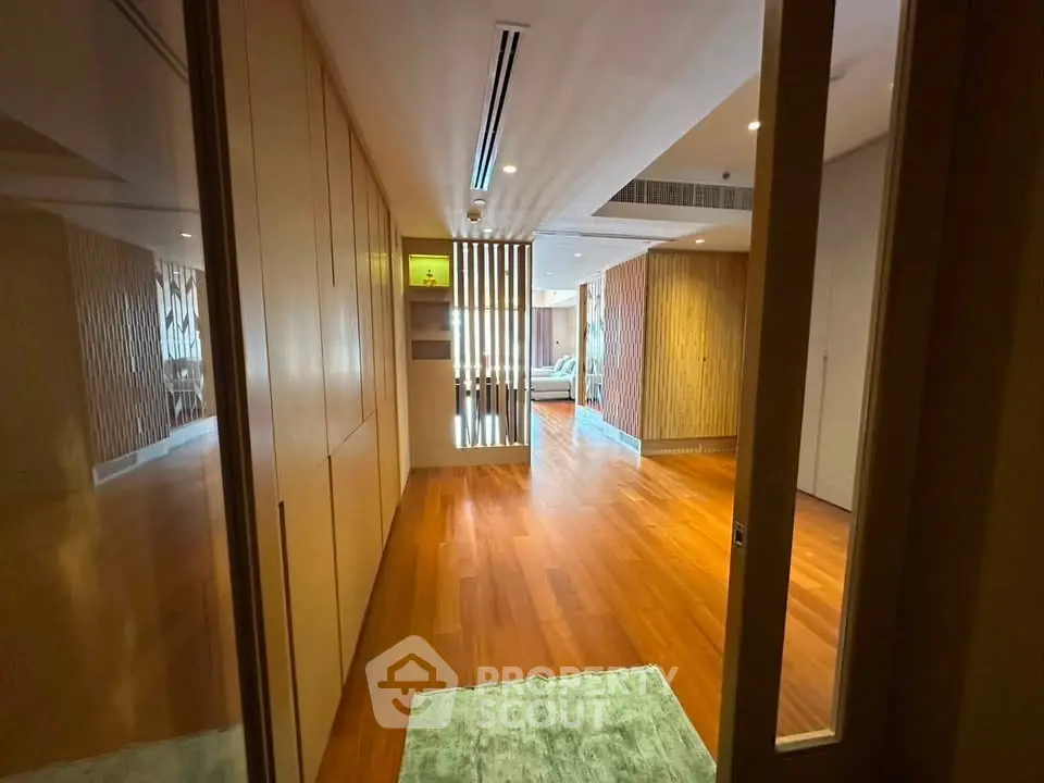 Spacious modern living room with wooden flooring and stylish decor