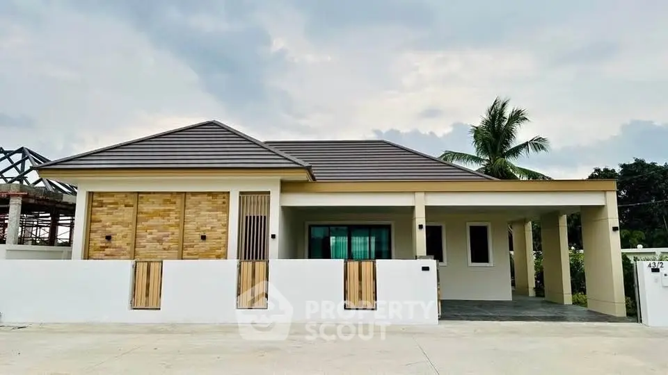 Modern single-story house with stylish facade and spacious driveway