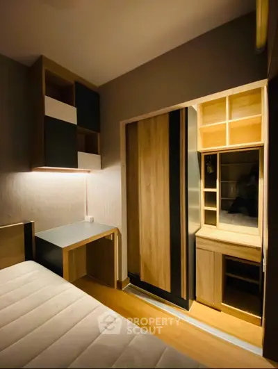 Cozy bedroom with modern wooden furniture and built-in storage solutions