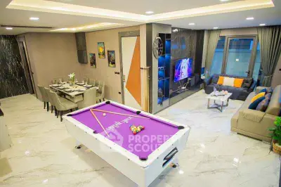 Luxurious living room with pool table and modern decor