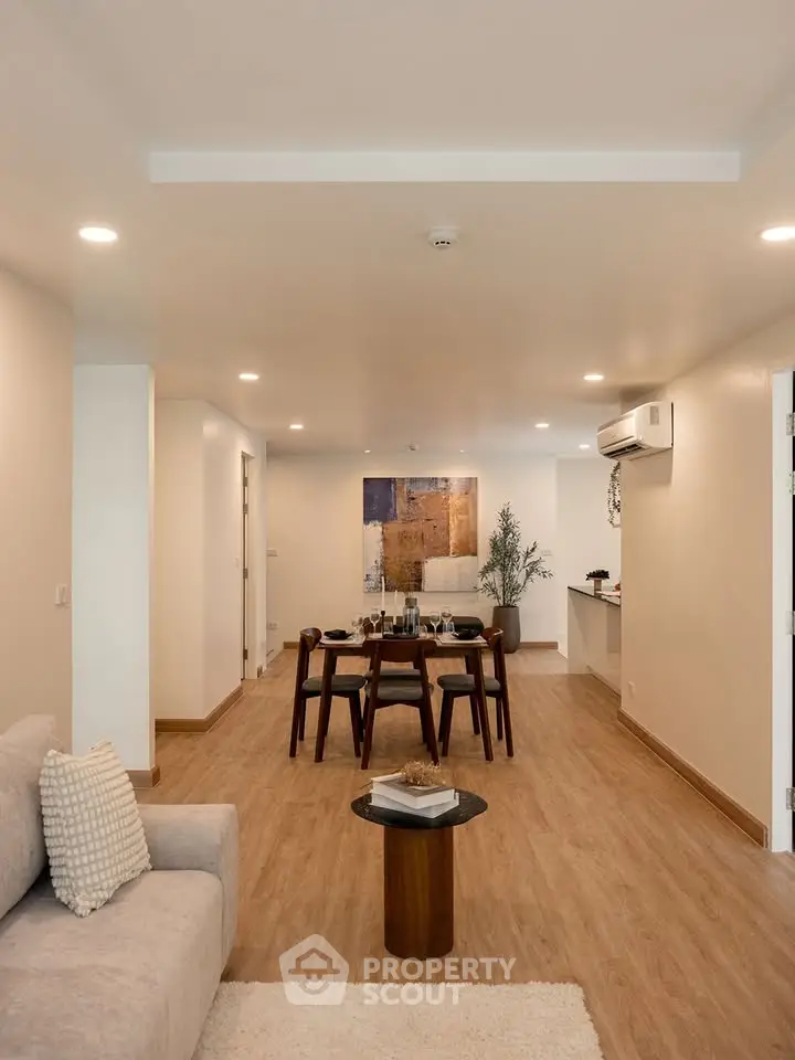 Spacious modern living room with elegant dining area and stylish decor