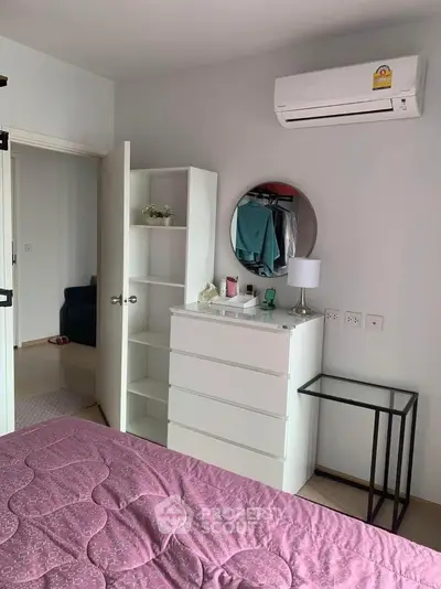 Cozy bedroom with modern furniture and air conditioning, perfect for comfortable living.