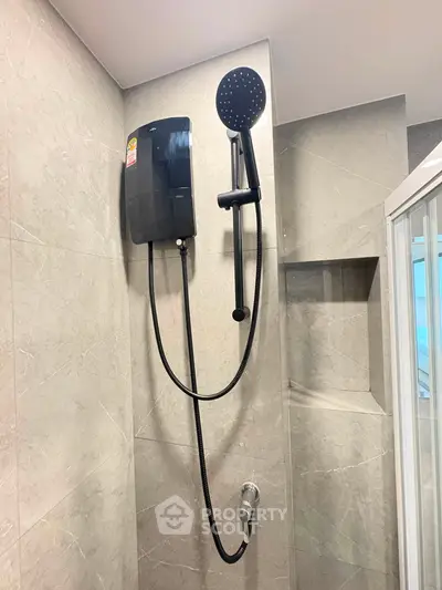 Modern bathroom with sleek shower and elegant gray tiles