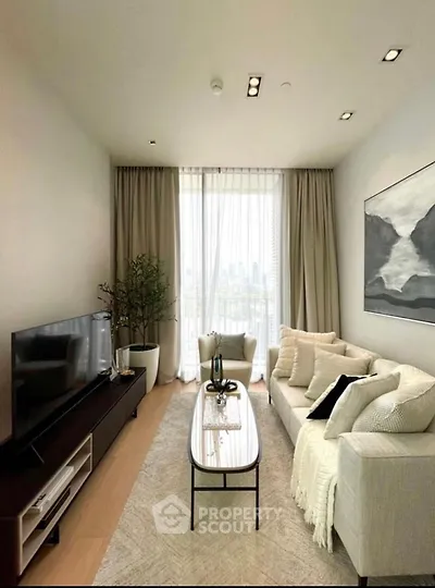 Stylish modern living room with cozy sofa and large window view