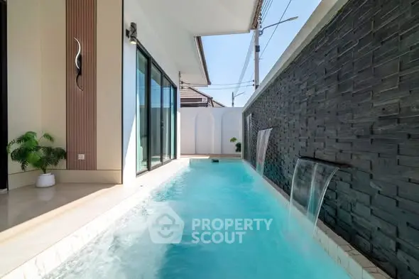 Luxurious private pool with modern water features and elegant design