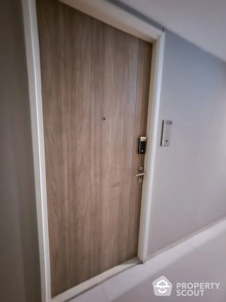 Modern apartment entrance with secure digital lock and sleek design