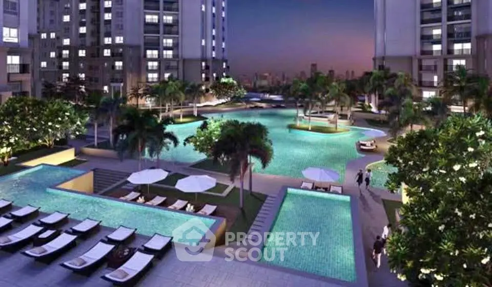 Luxurious residential complex with stunning pool and lush landscaping at dusk.