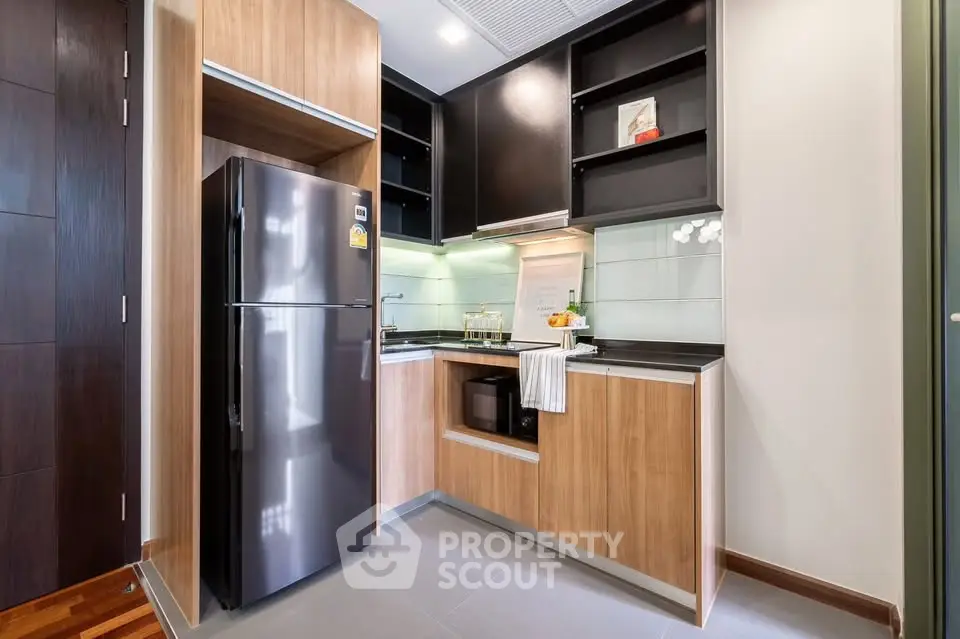 Modern kitchen with sleek appliances and wooden cabinetry