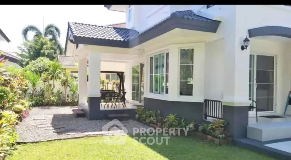 Charming suburban home with lush garden and spacious patio, perfect for outdoor entertaining.