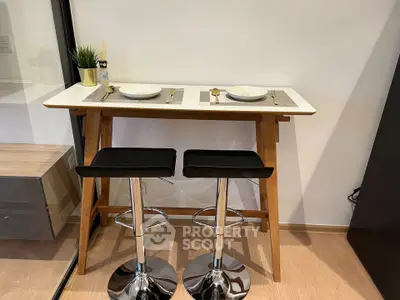 Modern dining nook with sleek bar stools and minimalist decor