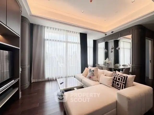 Luxurious modern living room with elegant decor and large windows