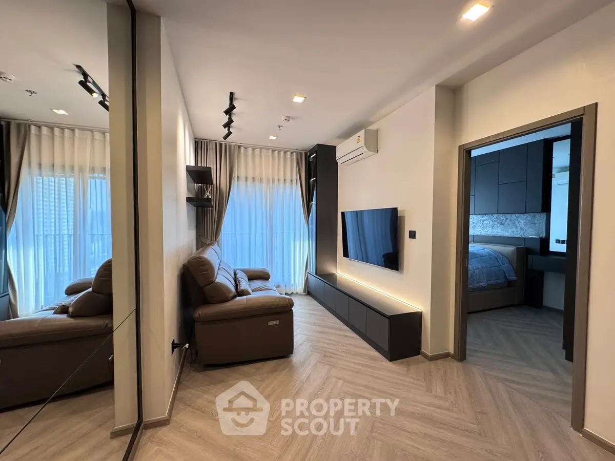 Modern living room with sleek design and cozy seating area