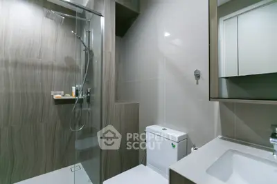 Modern bathroom with glass shower and sleek fixtures