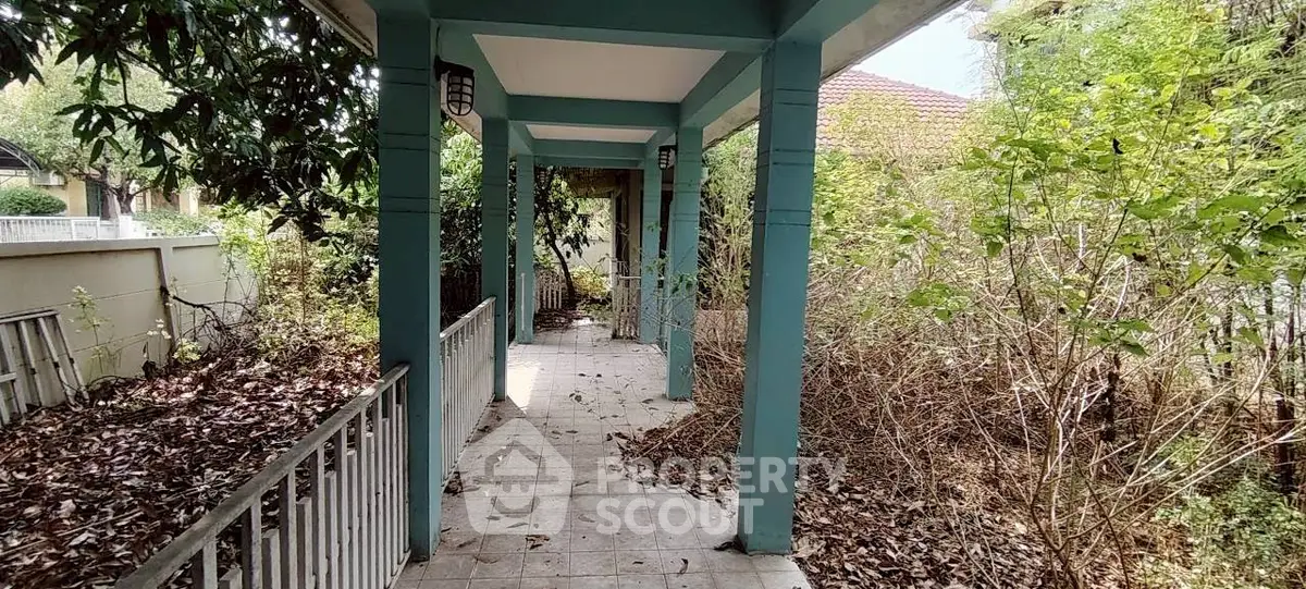 Charming outdoor walkway with lush greenery and rustic appeal