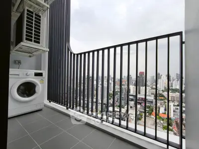 High-rise balcony with washing machine and stunning city view