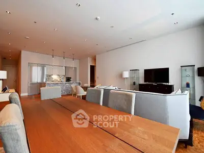 Spacious modern living room with open kitchen and elegant dining area