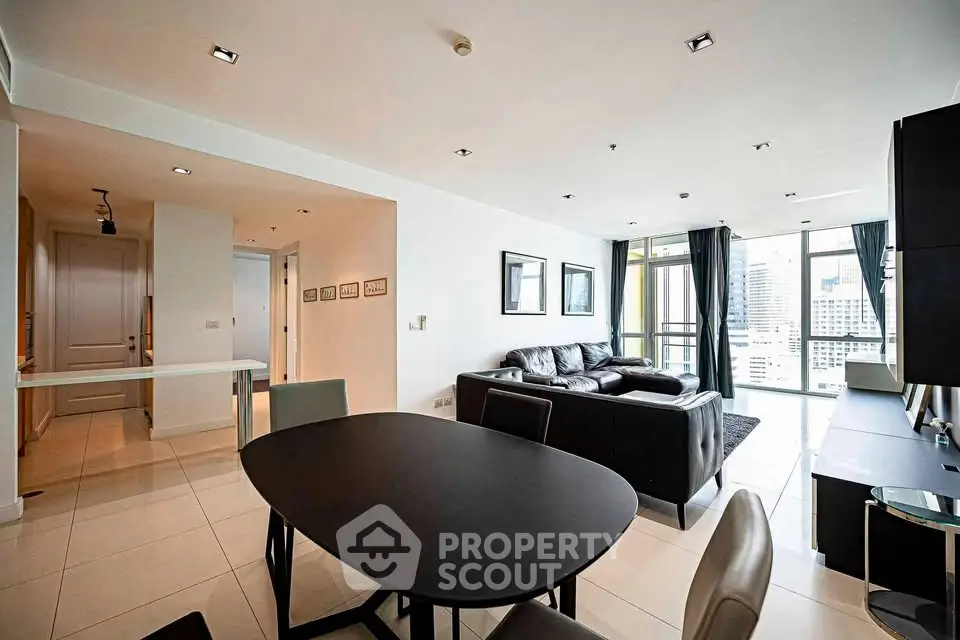 Spacious modern living room with city view and sleek furnishings