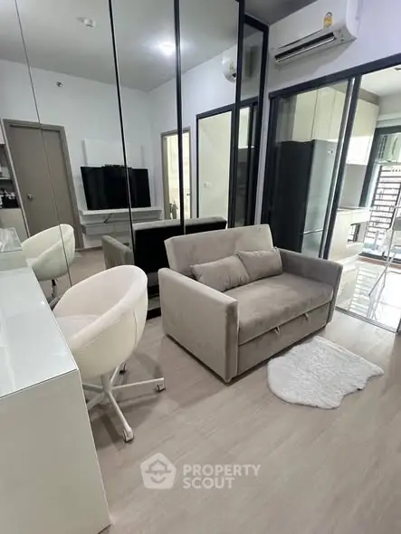 Modern living room with sleek design and cozy seating area