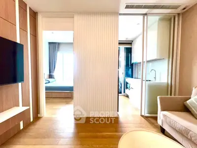 Modern apartment interior with open layout, featuring a cozy living area and sleek kitchen design.