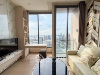 Luxurious living room with stunning city view, modern furniture, and floor-to-ceiling windows in high-rise apartment.