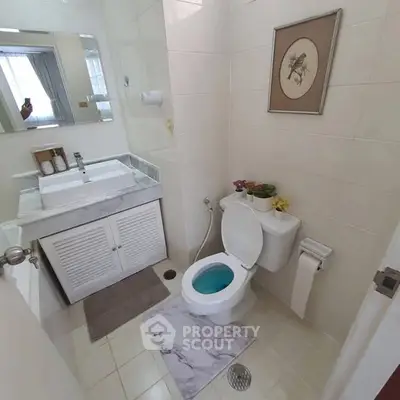 Charming bathroom with modern fixtures and elegant decor, perfect for a cozy home.